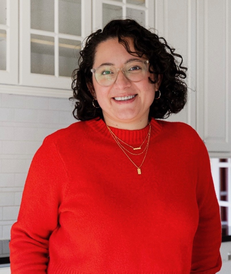 a woman in a red sweater